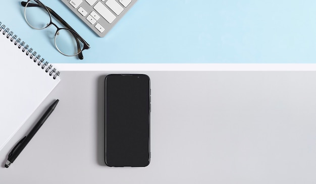 Workspace mockup smartphone screen for your design on a light gray and blue, white background.