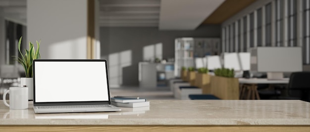 Photo workspace tabletop with laptop mockup and copy space over blurred office background