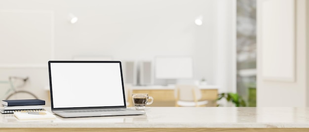 Workspace tabletop with laptop mockup and empty space over blurred minimal home office studio