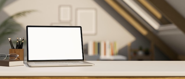 Workspace tabletop with notebook laptop mockup over blurred minimal home working room