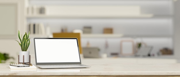 Workspace tabletop with notebook laptop mockup and copy space over blurred modern home studio