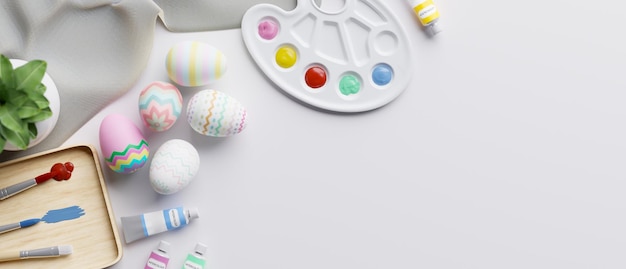 Workspace top view with colorful Easter eggs pinting tools and copy space on white background