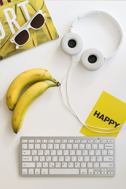 Workspace with bright yellow items and a greeting card spelling 