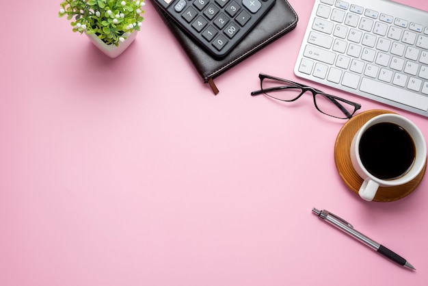 Workspace with equipment working concept on pink background copy space.