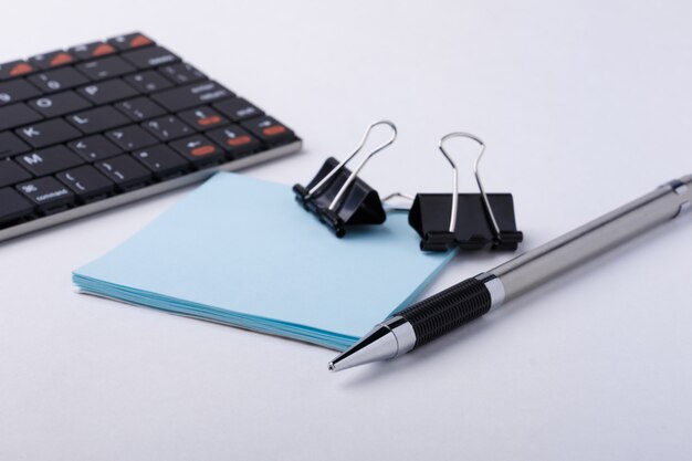 Photo workspace with keyboard and office supplies