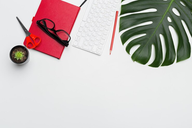 Photo workspace with keyboard, palm leaf and accessories. flat lay, top view copy space