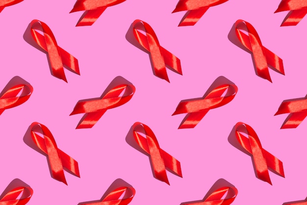 세계 에이즈의 날. 분홍색 배경에 완벽 한 패턴입니다. 에이즈 인식 개념입니다. 12월 1일