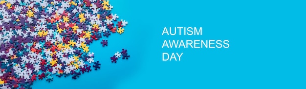 World autism awareness day bannera bunch of colorful puzzles on a blue background of puzzles high quality photo