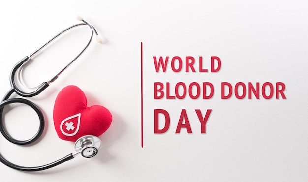 World blood donor day red cross and nurse day concept made from red heart and stethoscope on white background