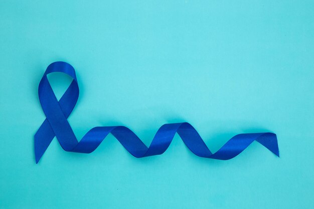 Photo world cancer day background colorful ribbons cancer awareness international agency for research on cancer