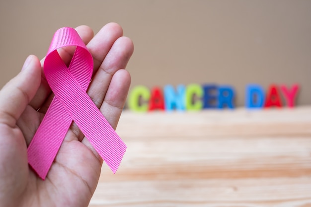 World cancer day (February 4) or Breast cancer,  pink ribbon 