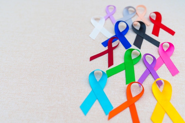 World cancer day February 4 Colorful ribbons for supporting people living and illness Healthcare fighting medical and National Cancer Survival day Autism awareness day concept