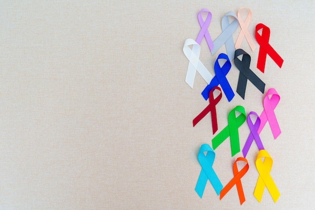 World cancer day February 4 Colorful ribbons for supporting people living and illness Healthcare fighting medical and National Cancer Survival day Autism awareness day concept