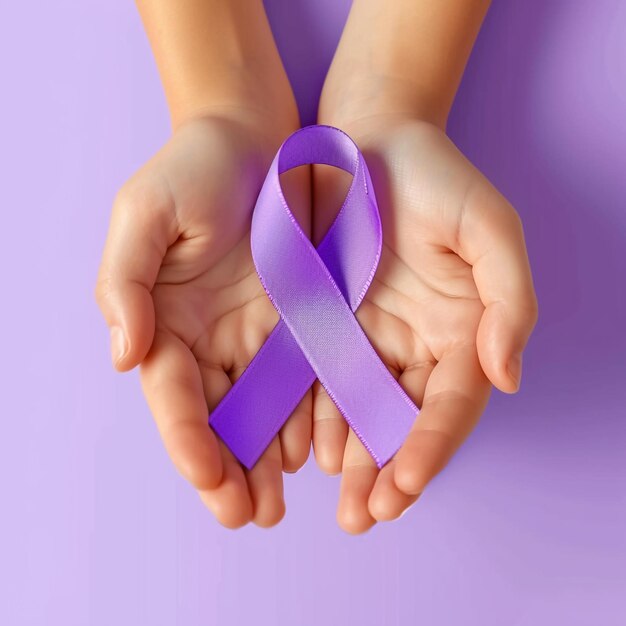 World cancer day hands holding purple ribbon on grey background with copy space for text