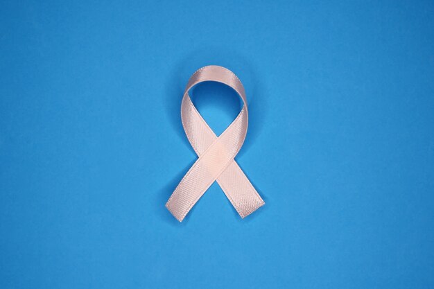 World Cancer Day. Ribbon on blue Background. February 4