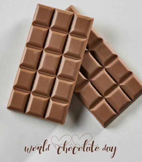 Photo world chocolate day background with chocolate with copy