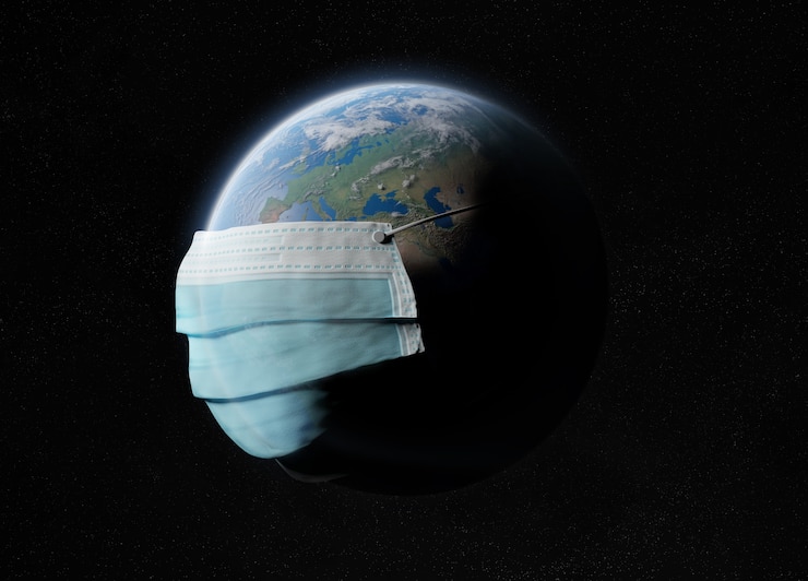 Photo the world covered by a surgical mask from the coronavirus pandemic.