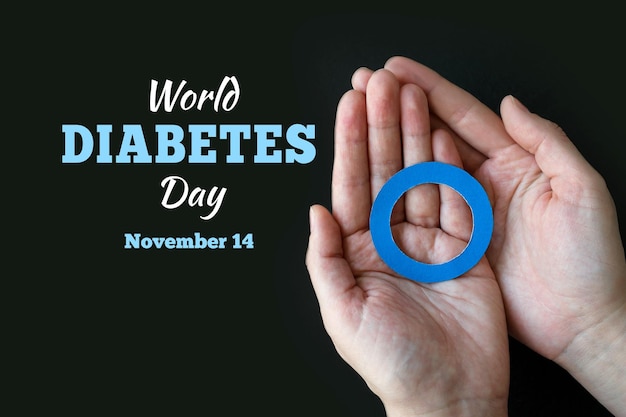 World Diabetes day Blue circle in hands of an adult is symbol of diabetes awareness 14 november