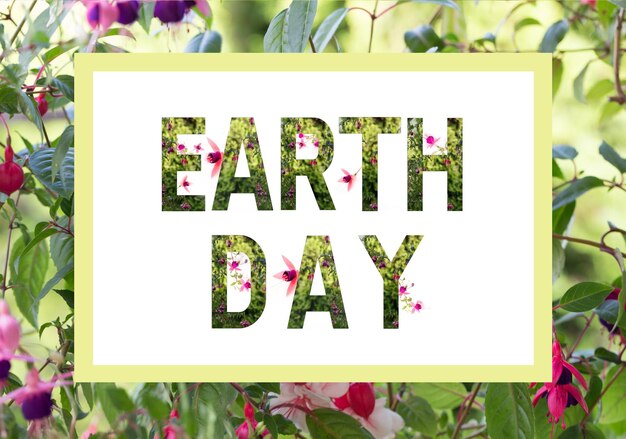 Photo world earth day concept lettering earth day with plants and wonderful flowers