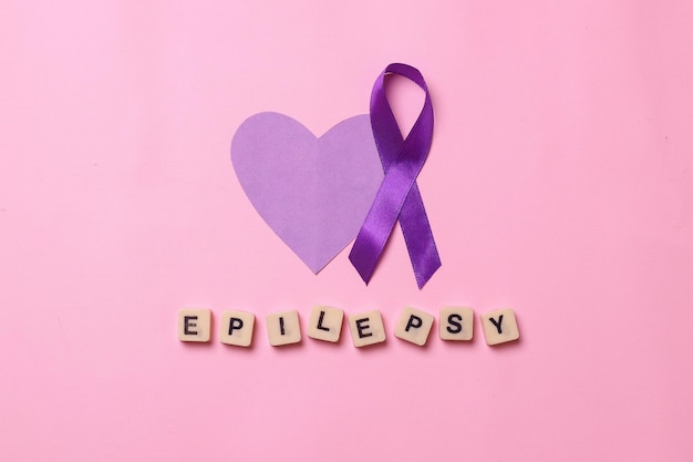 Photo world epilepsy day purple heart shape and purple ribbon awareness with epilepsy words