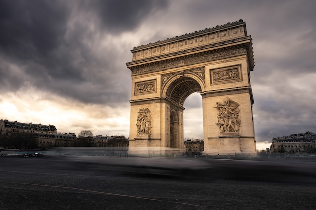 World famous Arc de Triomphe at the city center of Paris, France.