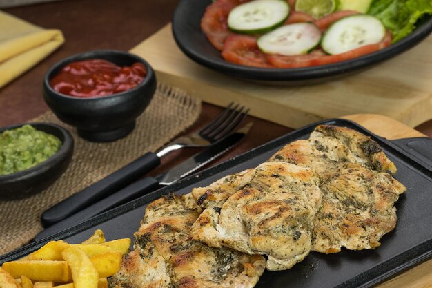 World food day grilled chicken breast with french fries in
dining room healthy food