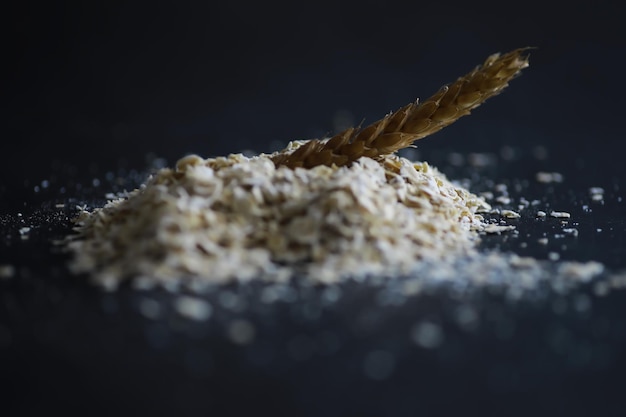 World grain crisis A handful of cereals and on a dark background