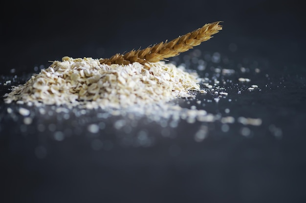 World grain crisis A handful of cereals and on a dark background