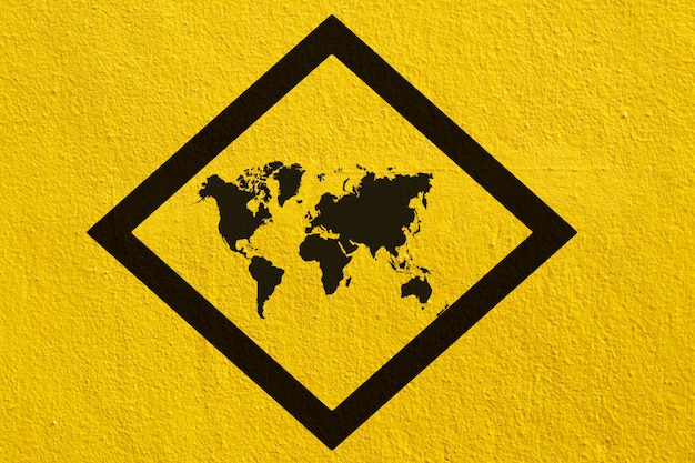 World map signs on yellow wall