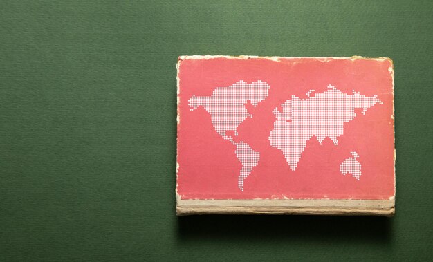 World map with a book