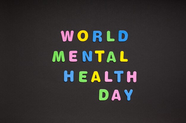 World Mental Health Day writing on black paper