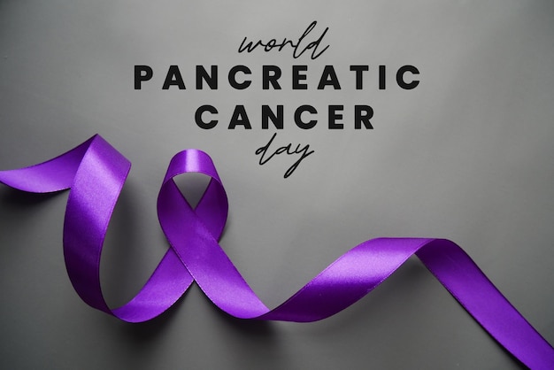 Photo world pancreatic cancer day with purple ribbon pancreatic cancer concept treatment and health