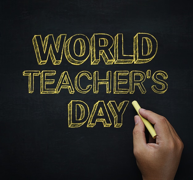 World Teacher&#39;s Day mannenhand schrijven op Blackboard