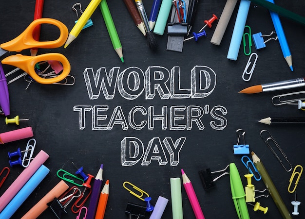 World Teacher's Day Text. School Stationary Top View on Blackboard