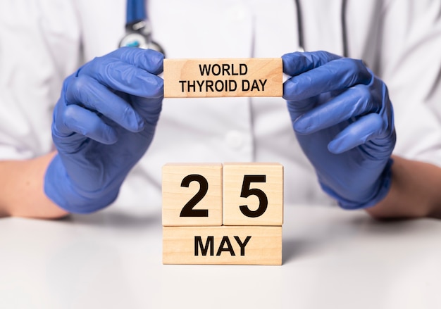 World thyroid day concept. 25 may date on wooden calendar.