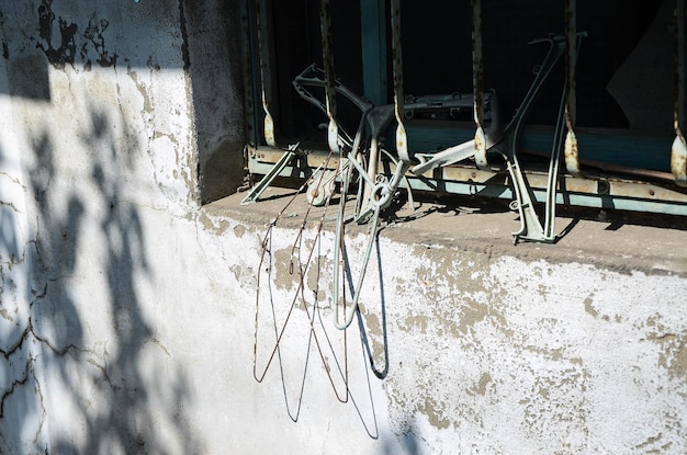 Worn hanger hanging by the window