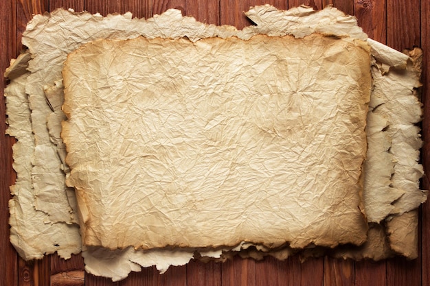 Worn old paper wood table background for text