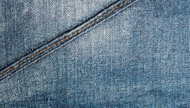 worn ragged blue denim texture simple classic indigo jeans background close up copy space