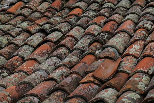 Wornout clay roofing in closeup