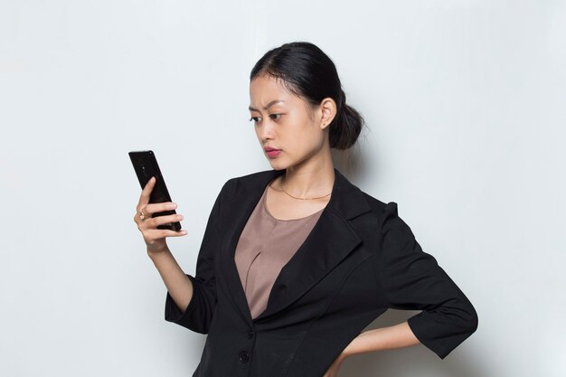 worried asian business woman with mobile phone