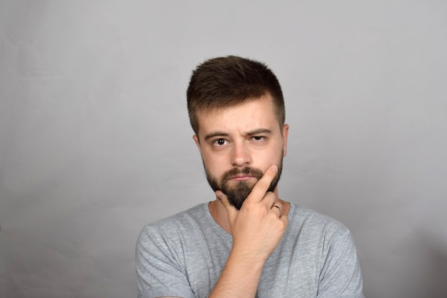 Worried bearded young man