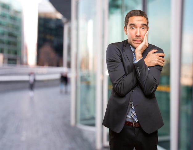 Worried businessman feeling cold