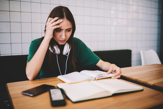 Worried hipster girl feeling stress from learning at university campus female student disappointed