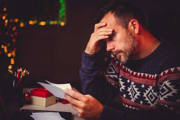 Worried Men cheeking his mail late night