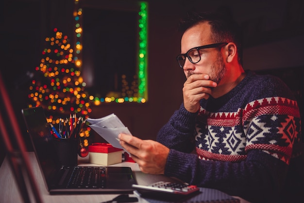 Worried Men cheeking his mail late night