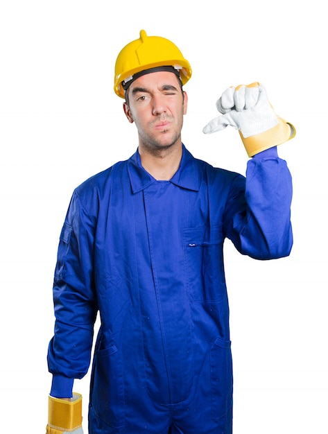 Worried workman with fail gesture on white background