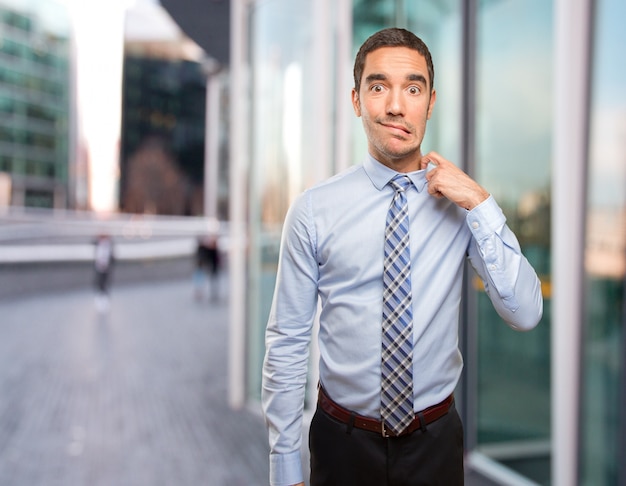 Worried young businessman with a gesture of stress