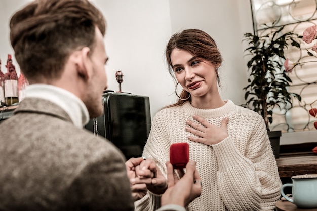 A worrying moment A woman feels happy while receiving a proposal