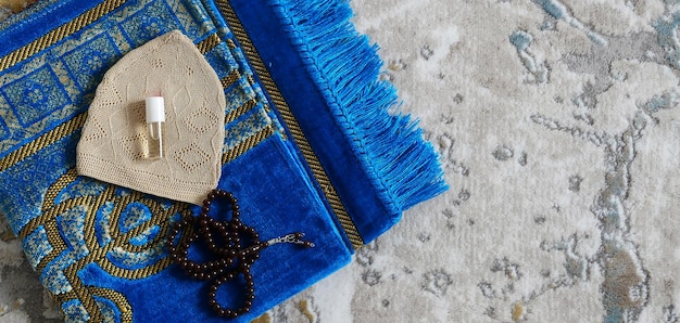 Worship materials used by Muslims prayer beads prayer rugs and fragrance