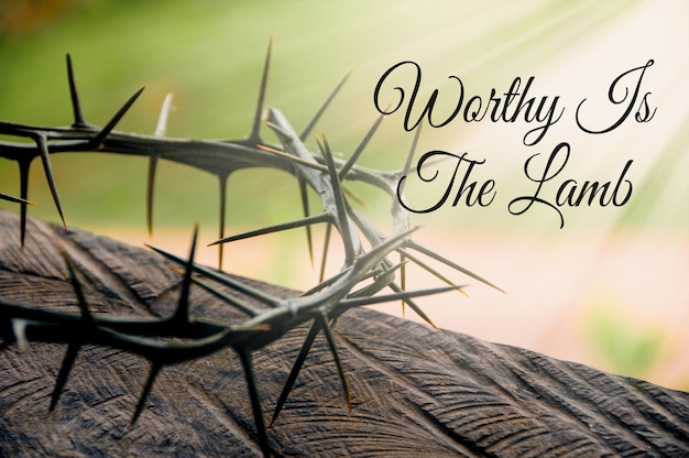 Worthy is the Lamb quote with shining Crown of thorns background Christianity concept